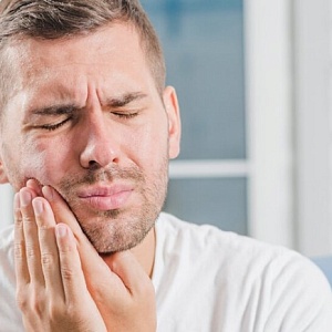 Почему ноют зубы: причины и лечение
